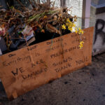 A sign asking that no one discard anything left at George Floyd Square. Since May 2020, all signs and offerings have been preserved by the George Floyd Global Memorial.“Do not discard sign. Everything is somebody’s offering. We are preserving damaged signs. Thank you!”