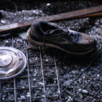 A shoe sits in broken glass inside a fire damaged pawn shop. The shop was destroyed in riots following the May 25th, 2020 death of George Floyd.