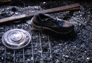 A shoe sits in broken glass inside a fire damaged pawn shop. The shop was destroyed in riots following the May 25th, 2020 death of George Floyd.