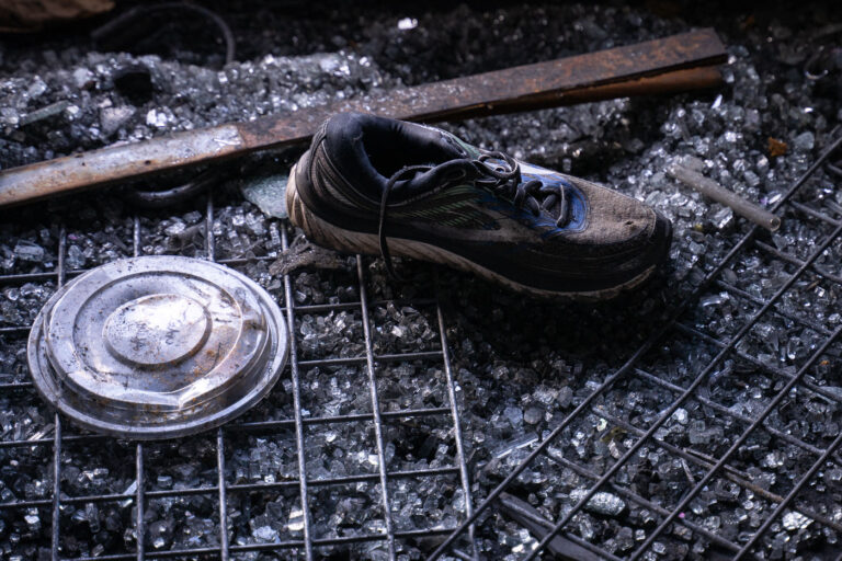 Max It Pawn on Cedar Ave 2 A shoe sits in broken glass inside a fire damaged pawn shop. The shop was destroyed in riots following the May 25th, 2020 death of George Floyd.