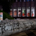 Graffiti outside and on the windows of the Federal Courthouse in downtown Minneapolis.
