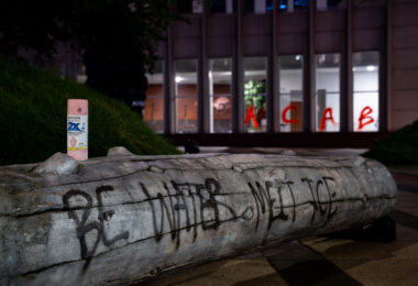 Graffiti outside and on the windows of the Federal Courthouse in downtown Minneapolis.