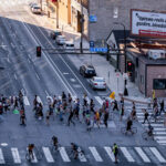 Uptown Reels after gunfire, bloodshed 1 Protesters march around the Federal Courthouse in downtown Minneapolis. Protesters gathered on July 23rd, 2020 to protest federal officers being deployed to cities around the country. Billboard above that reads “Uptown reels after gunfire, bloodshed”.