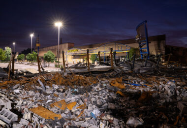 A Dollar General store on East Lake Street in South Minneapolis. In the foreground, what’s left of an HR Block store.