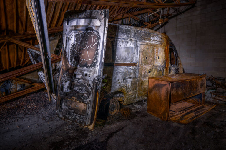 Burned Postal Service Van 4 A burned out USPS van inside a burned down Post Office in South Minneapolis. The building burned in riots following the May 25th, 2020 death of George Floyd.