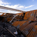 Caved in roof after a fire damaged Max It Pawn on Cedar Ave following the May 25th, 2020 death of George Floyd.