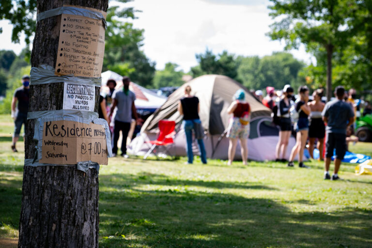 Powderhorn Park Encampment 4 Signs on a tree located near the entrance to the Powderhorn East homeless encampment in South Minneapolis. The encampment was cleared by Minneapolis Police on July 21, 2020.