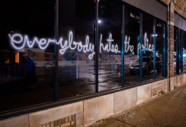 “Everybody hates the police” written on the windows of a downtown Minneapolis building.