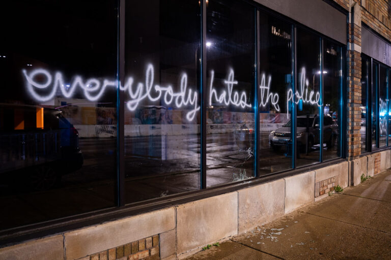 Everybody hates the police 4 “Everybody hates the police” written on the windows of a downtown Minneapolis building.