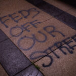“FEDS Off Our Street” written on US Federal Courthouse Property in Downtown Minneapolis.