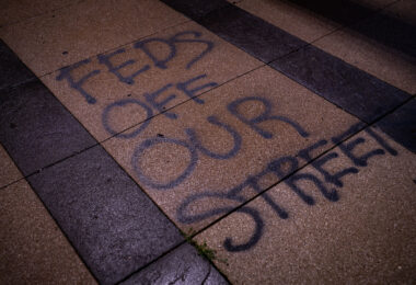 “FEDS Off Our Street” written on US Federal Courthouse Property in Downtown Minneapolis.