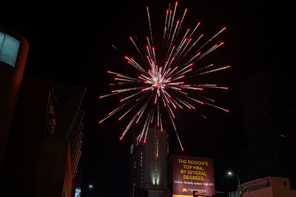 Fireworks being lit off on 1st Avenue in downtown Minneapolis. Police drove through to clear the crowd.