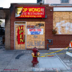 Hop Wong Chinese Restaurant on Chicago Ave with boards on it after the May 25th, 2020 death of George Floyd.
