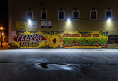 A large mural on the side of a building on Nicollet Ave in Minneapolis. “Floyd’s World” “Taking about the revolution”.