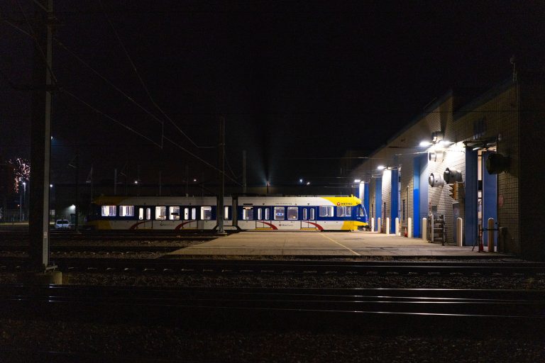 Metro Transit Light Rail Vehicle at Maintenance Facility, South Minneapolis 4 Metro Transit light rail car parked outside a maintenance facility at night in South Minneapolis.