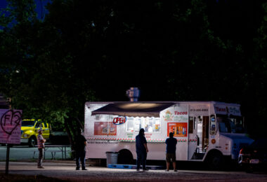 People social distancing in line at a taco food truck on Lake Street.=