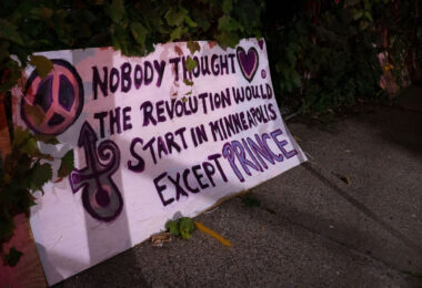A board in front of a home that reads “Nobody thought the revolution would start in Minneapolis except Prince”.