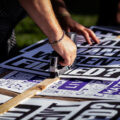 Protest signs being stapled together prior to the “How many weren’t filmed?” March through Uptown Minneapolis.