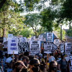 Protesters marching through Uptown Minneapolis on the “How many weren’t filmed?” March.