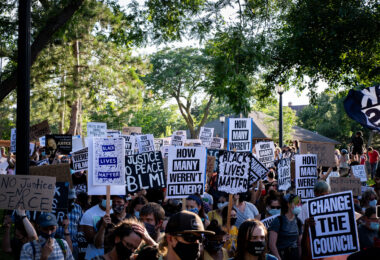 Protesters marching through Uptown Minneapolis on the “How many weren’t filmed?” March.