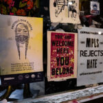 Signs in a window of a store in Minneapolis that read “Protect our elders” “MPLS Rejects Hate” “You are welcome here you belong”