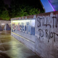 “Still time to riot” written on the side of US Bank Stadium in Downtown Minneapolis.