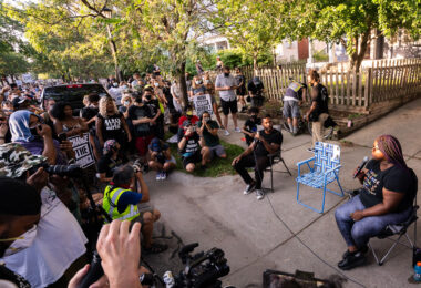Toussaint Morrison and Nekima Levy Armstrong sitting outside a city council members home taking questions from the crowd. The crowd was part of the march that was led through Uptown Minneapolis on July 24, 2020.