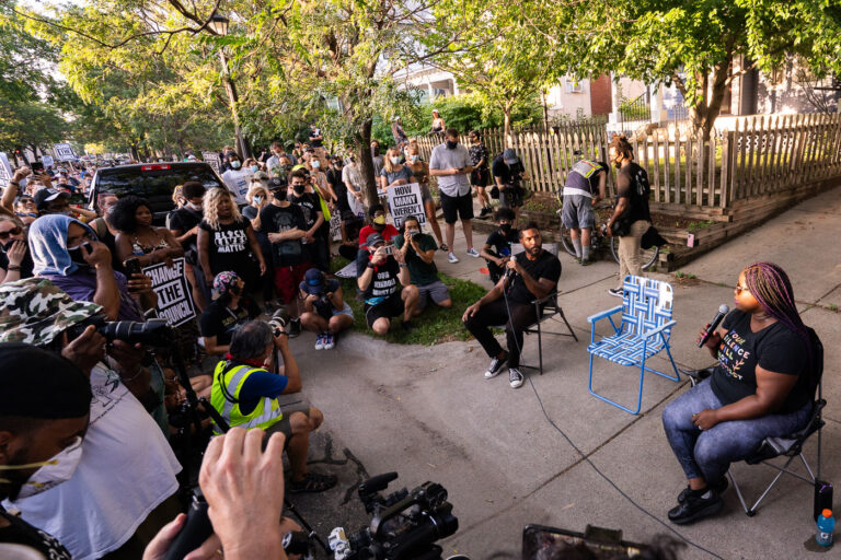 Toussaint Morrison and Nekima Levy Armstrong 2 Toussaint Morrison and Nekima Levy Armstrong sitting outside a city council members home taking questions from the crowd. The crowd was part of the march that was led through Uptown Minneapolis on July 24, 2020.