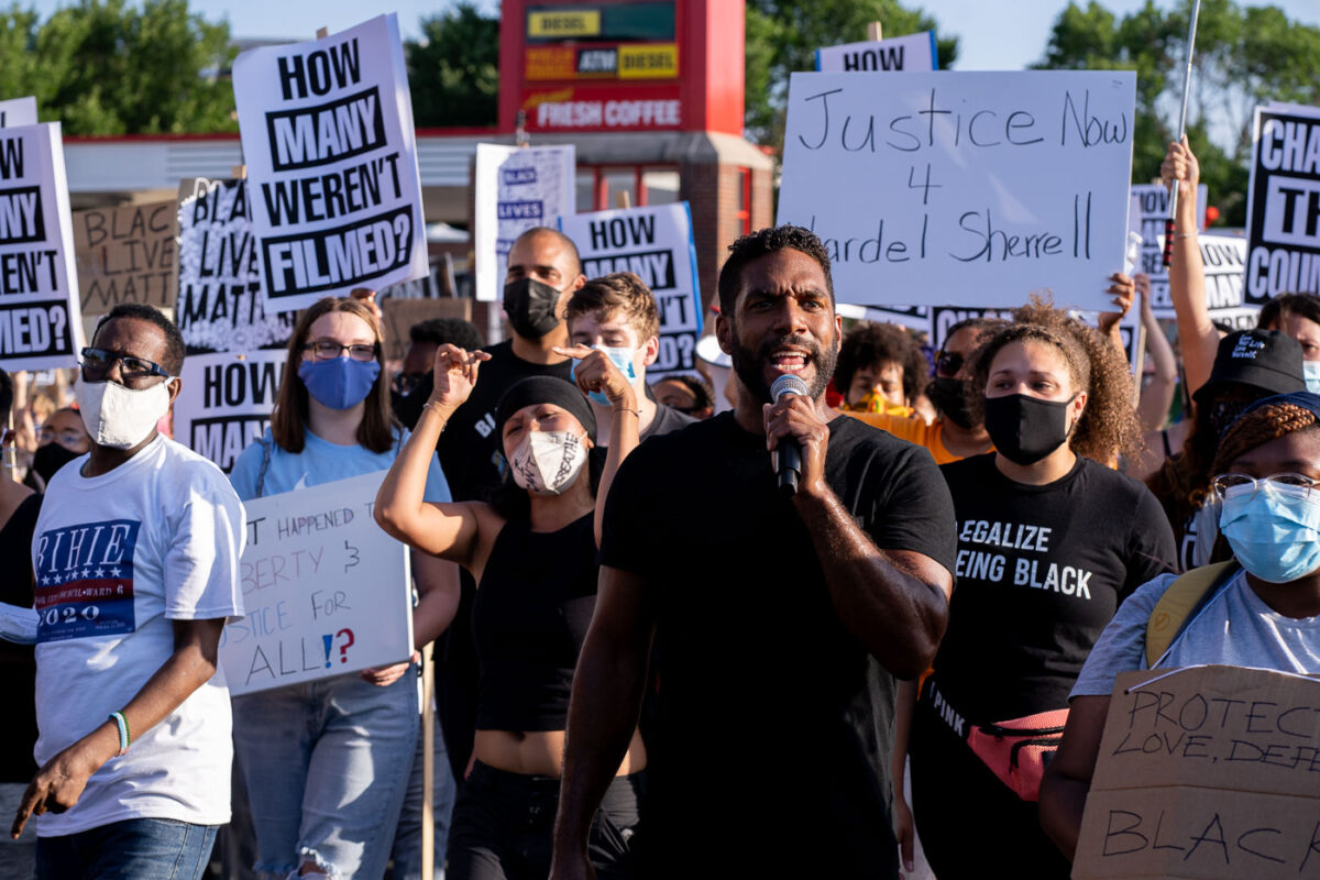 Toussaint Morrison leads the “How many weren’t filmed?” March down Hennepin Ave in Uptown Minneapolis.