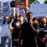 Toussaint Morrison leads the “How many weren’t filmed?” March down Hennepin Ave in Uptown Minneapolis.