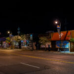 West Lake Street with boards on businesses.