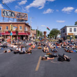 Protesters stage a "lay in" for 8 minutes and 46 seconds - the amount of time the Minneapolis Police knelt on George Floyd's neck.