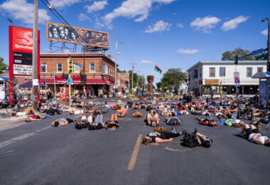 Protesters stage a "lay in" for 8 minutes and 46 seconds - the amount of time the Minneapolis Police knelt on George Floyd's neck.