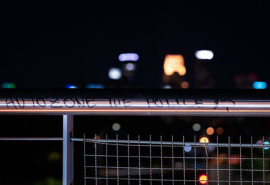 The Martin Olav Sabo bridge over Haiwatha Ave with "Autozone the police" written on it. AutoZone was the first building burned following the May 25th, 2020 death of George Floyd.