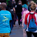 Man wearing a  "Bryant Neighborhood Organization" shirt at George Floyd Square.