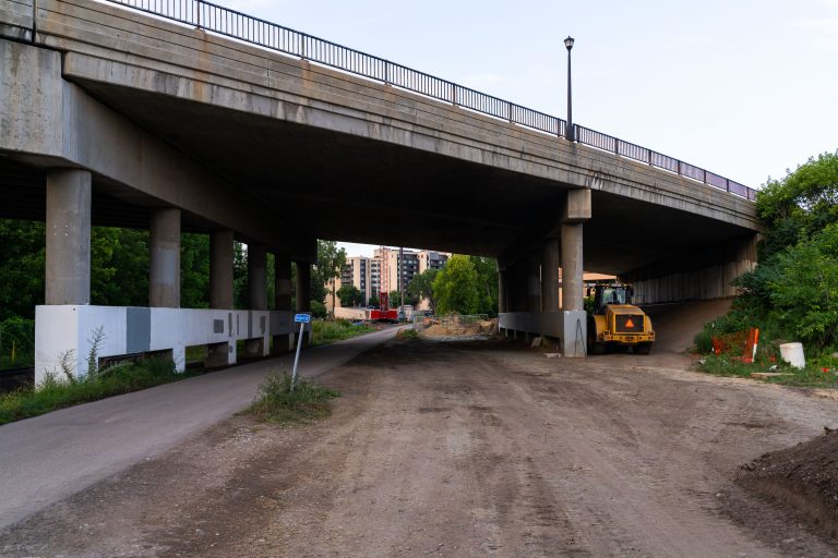 Construction at the Lake Street Bridge Over the Midtown Greenway 3 Construction site under highway overpass for Minneapolis Metro Green Line West Lake Street station.