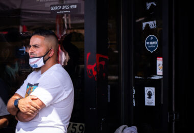 On the day Cup Foods re-opened, owner Mahmoud Abumayyaleh looks out at the memorial in front of his store where George Floyd was killed on May 25th, 2020.