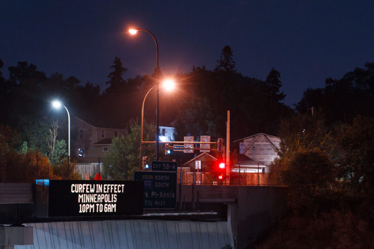 A digital sign on interstate 394 announcing a curfew put in place over riots following false rumors on the evening of August 26th.