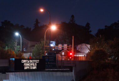 A digital sign on interstate 394 announcing a curfew put in place over riots following false rumors on the evening of August 26th.