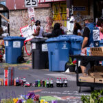 Free drinks and produce outside of Cup Foods next to a "Keep Cup Closed" sign on the day Cup Foods re-opened following the May 25th, 2020 death of George Floyd.