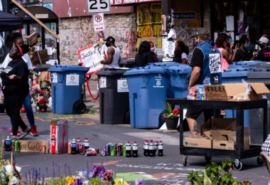 Free drinks and produce outside of Cup Foods next to a "Keep Cup Closed" sign on the day Cup Foods re-opened following the May 25th, 2020 death of George Floyd.