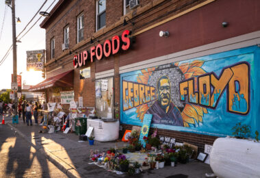 The George Floyd mural at George Floyd Square with flowers on August 17, 2020.