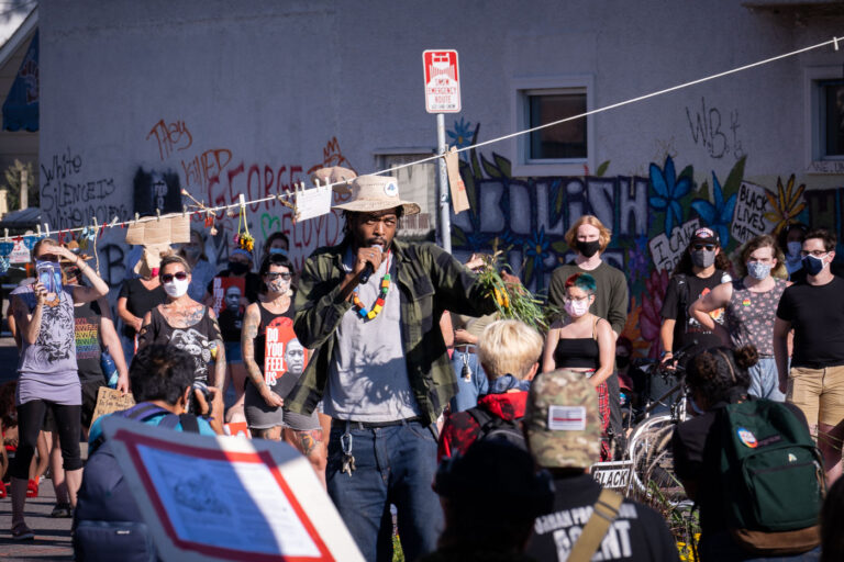 George Floyd Square Caretaker Jay Webb Speaks 2 George Floyd Square garden caretaker Jay Webb speaks with those gathered at a rally at George Floyd Square on the day that President Trump was in town.