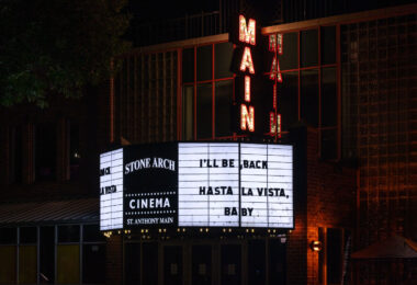 Cinema located at 115 SE Main St. in Minneapolis with "I'll Be Back, Hasta La Vista Baby" on the marquee.