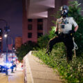 Hennepin County Sheriffs Officer with a gas mask on outside the Hennepin County Jail in downtown Minneapolis.