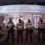 Hennepin County Sheriff's Officers guarding the Hennepin County Jail in downtown Minneapolis. Protesters were gathering after about a dozen protesters were arrested following a large march in solidarity with Jacob Blake.