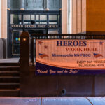 A "Heroes work here" sign at the Main Post Office in Downtown Minneapolis.