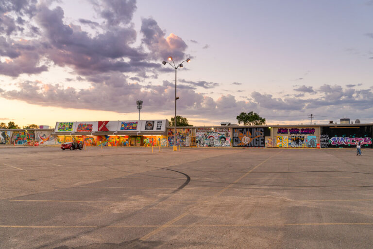 Former K-Mart Murals, West Lake Street, Minneapolis 4 The former K-Mart store on West Lake Street in Minneapolis displays extensive murals created in the aftermath of the 2020 protests. These artworks, some depicting portraits and messages related to the Minneapolis Uprising, transformed the building's exterior into a public canvas. The retail store has since been repurposed as a United States Post Office, providing essential services after two local post offices were destroyed by fire during the protests. This site now functions as both a civic building and a significant historical marker of community expression.