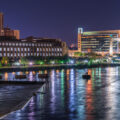 The Mississippi River in Downtown Minneapolis United States Post Office, Hennepin Ave Bridge and United States Federal Reserve also pictured.