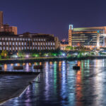 The Mississippi River in Downtown Minneapolis United States Post Office, Hennepin Ave Bridge and United States Federal Reserve also pictured.